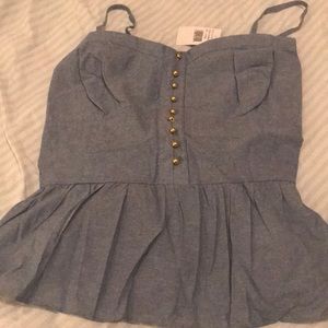 Bustier peplum denim top.